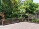 A spacious wooden deck surrounded by lush greenery offers a tranquil outdoor living space at 907 W Johnson St, Raleigh, NC 27605
