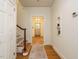 Inviting entryway with hardwood floors, staircase, and view to front door at 907 W Johnson St, Raleigh, NC 27605