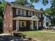Beautiful two-story brick home with well-maintained landscaping and a welcoming front porch at 907 W Johnson St, Raleigh, NC 27605