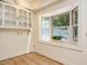 Bright breakfast nook featuring a bay window and built-in display cabinet at 907 W Johnson St, Raleigh, NC 27605