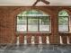 Inviting sunroom with brick arches and large windows offering plenty of sunlight at 907 W Johnson St, Raleigh, NC 27605