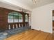 Charming sunroom featuring brick arches, a ceiling fan, and unique slate flooring at 907 W Johnson St, Raleigh, NC 27605
