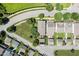 Aerial view of homes showcasing well-maintained lawns, mature trees, and neighborhood street layout at 915 Chapanoke Rd, Raleigh, NC 27603