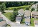 Overhead view of a home with a solar-paneled garage, screened-in porch, and backyard at 915 Chapanoke Rd, Raleigh, NC 27603