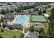 Aerial shot of community amenities, including a pool, tennis court, playground, and clubhouse at 915 Chapanoke Rd, Raleigh, NC 27603