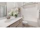 Clean bathroom has shower and tub combo, single sink vanity, and neutral finishes at 915 Chapanoke Rd, Raleigh, NC 27603