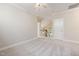 Neutral bedroom with crown molding, ceiling fan, and access to upstairs hallway at 915 Chapanoke Rd, Raleigh, NC 27603