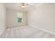 Cozy neutral bedroom featuring carpeted floors, ceiling fan and one window with blinds at 915 Chapanoke Rd, Raleigh, NC 27603