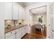 Dining room includes hardwood floors, crown molding, and decorative pendant lighting at 915 Chapanoke Rd, Raleigh, NC 27603