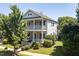 Charming two-story home with a inviting double porch and landscaped yard at 915 Chapanoke Rd, Raleigh, NC 27603