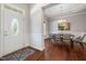 Foyer and dining area showcasing hardwood floors, crown molding, and natural light at 915 Chapanoke Rd, Raleigh, NC 27603