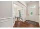 Entryway with hardwood floors transitions to office with french doors and foyer with front door at 915 Chapanoke Rd, Raleigh, NC 27603