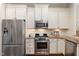 Modern kitchen with stainless steel appliances and granite countertops at 915 Chapanoke Rd, Raleigh, NC 27603