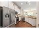 Bright kitchen with stainless steel appliances and hardwood floors at 915 Chapanoke Rd, Raleigh, NC 27603