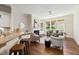 Open concept living area with a kitchen bar, fireplace, and built-in shelves at 915 Chapanoke Rd, Raleigh, NC 27603