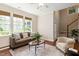 Inviting living room featuring hardwood floors, neutral tones, and bright windows at 915 Chapanoke Rd, Raleigh, NC 27603
