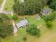 Aerial image of the home and the grounds which include a garden plot and outbuilding at 100 Martindale Dr, Youngsville, NC 27596