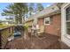 Inviting back deck featuring outdoor seating, a grill, and a view of the house at 100 Martindale Dr, Youngsville, NC 27596