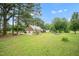 Beautiful home with large backyard, mature trees and basketball court at 100 Martindale Dr, Youngsville, NC 27596