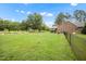 Expansive fenced backyard with a lush lawn, ideal for outdoor activities and relaxation at 100 Martindale Dr, Youngsville, NC 27596