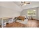 Bedroom featuring hardwood floors, natural light, and a neutral color scheme at 100 Martindale Dr, Youngsville, NC 27596