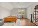 Bedroom featuring hardwood floors, natural light, and a neutral color scheme at 100 Martindale Dr, Youngsville, NC 27596