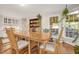 Dining area featuring a wooden table, built-in shelves, and large window with views at 100 Martindale Dr, Youngsville, NC 27596