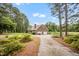 Lovely traditional brick home with a convenient attached two-car garage and a circular drive at 100 Martindale Dr, Youngsville, NC 27596
