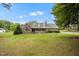 Traditional brick home with dormer windows, inviting front porch and a large front yard at 100 Martindale Dr, Youngsville, NC 27596