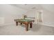 Inviting game room featuring a classic pool table, a custom sink, and ample space for entertainment at 100 Martindale Dr, Youngsville, NC 27596