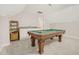 Inviting game room featuring a classic pool table, a custom sink, and ample space for entertainment at 100 Martindale Dr, Youngsville, NC 27596