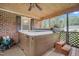 Inviting hot tub on a screened-in porch, creating a relaxing atmosphere at 100 Martindale Dr, Youngsville, NC 27596