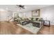 Spacious living room featuring wood floors, a ceiling fan and neutral decor for versatile styling at 100 Martindale Dr, Youngsville, NC 27596
