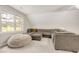 Comfortable living space featuring a cozy sectional couch, a soft beanbag chair, and ample natural light at 100 Martindale Dr, Youngsville, NC 27596