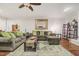Comfortable living room with a neutral color palette and abundant natural light at 100 Martindale Dr, Youngsville, NC 27596