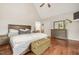 Spacious main bedroom with vaulted ceiling, ensuite access, and views of the backyard at 100 Martindale Dr, Youngsville, NC 27596