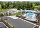 Community clubhouse with a swimming pool, playground, green space, parking area and well manicured landscaping at 1006 Whistler St, Durham, NC 27713