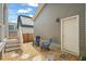 Charming backyard space with pea gravel, stepping stones, and patio chairs by back entrance at 1006 Whistler St, Durham, NC 27713