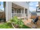 Backyard area featuring a covered porch, rock area, and stairs to yard at 1006 Whistler St, Durham, NC 27713