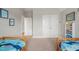 Shared bedroom with two twin beds and decor, perfect for siblings or guests to enjoy together at 1006 Whistler St, Durham, NC 27713