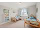 bedroom featuring two twin beds with coastal-themed decor and plenty of natural light at 1006 Whistler St, Durham, NC 27713