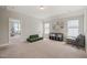 Bright and airy bonus room featuring carpeted flooring, natural lighting, and adaptable spaces for activities at 1006 Whistler St, Durham, NC 27713