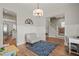 Open dining area with hardwood floors, white wainscoting, and view of the staircase at 1006 Whistler St, Durham, NC 27713