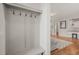 Hallway with a built-in bench and coat rack leads to an open-concept living area at 1006 Whistler St, Durham, NC 27713