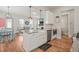 Open concept kitchen with granite counters, stainless appliances, and view to living area at 1006 Whistler St, Durham, NC 27713