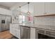 Modern kitchen featuring granite countertops, stainless steel appliances, and open layout at 1006 Whistler St, Durham, NC 27713