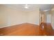 Bedroom with tray ceilings, hardwood flooring, and an ensuite bathroom and walk-in closet at 102 Mikaila Dr, Gibsonville, NC 27249