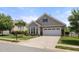 Attractive home featuring neat landscaping, stone details, and an attached garage at 102 Mikaila Dr, Gibsonville, NC 27249