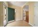 Open foyer featuring tile flooring, arched doorways, and views into the living space at 102 Mikaila Dr, Gibsonville, NC 27249