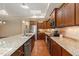 Gourmet kitchen with stainless steel appliances, granite countertops, and ample cabinet space at 102 Mikaila Dr, Gibsonville, NC 27249